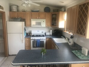Kitchen has Newer Appliances Including Stove/Oven, Microwave, Dishwasher, etc.