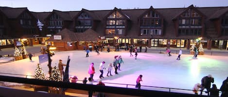 Magical view of ice skaters and the mountains from your private balcony 