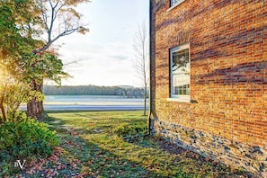 As the sun sets in the fall at Reed Homestead