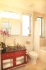 The Bathroom is Warm & Light, featuring a Jacuzzi Bathtub