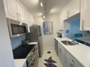 Kitchen with new counter tops updated appliances Keurig coffee maker