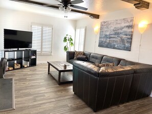 Living room with sectional sofa and flat screen cable tv and WiFi