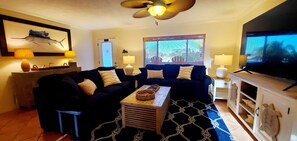 Enjoy gathering in the large comfortable living room with 75 inch TV