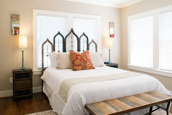 Front Bedroom with handmade headboard and a rustic chic ambiance.