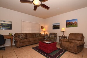 Living Room with Queen Sofa Sleeper, Chair and Recliner