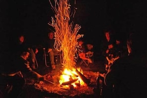 Relaxing around the fire - Ahhh!  With 8.5 acres of up north privacy.