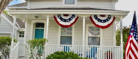 Our 1865 Victorian-Era Cottage, seen here on July 4th, 2023.