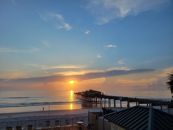 Sunrise from balcony. Within steps to Crabby Joe’s Fishing Pier, and restaurant.