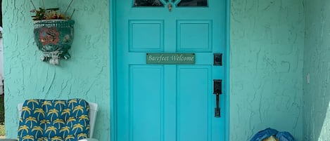 Front door of Ooo Laa Laah. It sits back off of Rudolph Ave. One story house.
