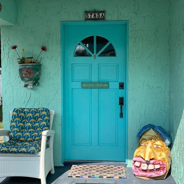 Front door of Ooo Laa Laah. It sits back off of Rudolph Ave. One story house.
