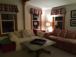 Living Room with Comfy Couches to lounge and relax after a long day on the beach