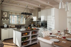 full equipped open kitchen next to the dining area