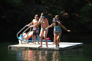 Swim platform with ladder, pedalboat and kayaks to cruise the pond