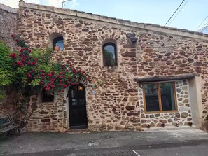 Front of house with window into living room.