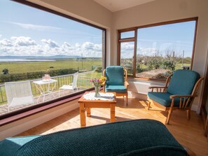 Sun Room with views of ocean/sea and our rural landscape. Ever Changing Skies!
