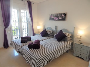Twin bedroom with air conditioning and fitted wardrobes