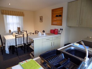 Well-equipped kitchen with dining table