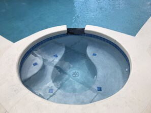 Hot Tub with controls to divert water from Pool to Hot tub.  Gets up to 105'F.