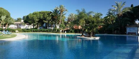 The main pool has a kids pool and gradual entry with numerous sunbeds. 