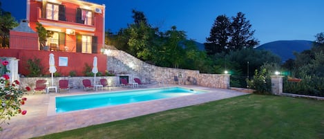 VIEW OF OUR PRIVATE POOL AND GARDEN WITH GRASS AT NIGHT