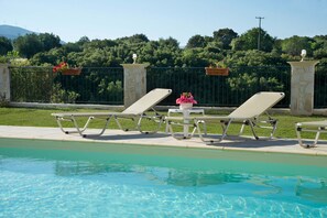 SUNBATHING IN THE PRIVATE POOL
