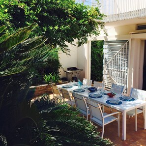 Summer lunch on the terrace surrounded by gardens