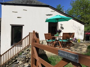 Outdoor seating area in large private garden