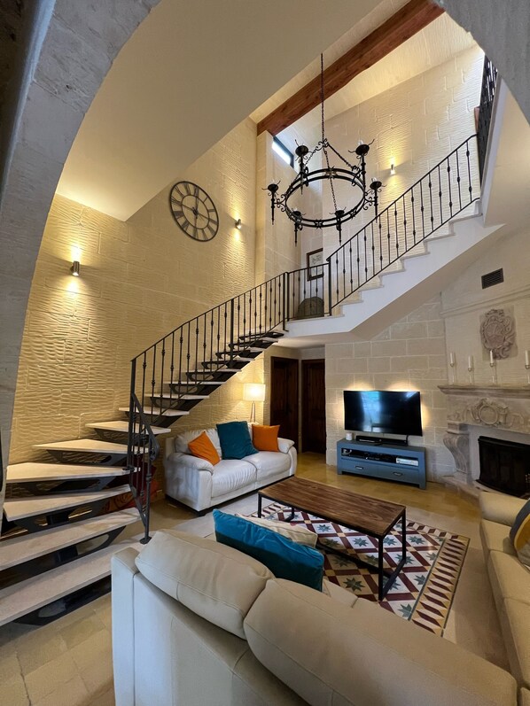 The lounge area and magnificent staircase.