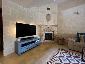 Audio visual area along with the hand built fireplace.