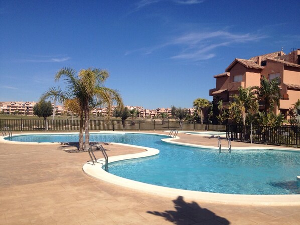 Our lovely apartment overlooking the shared pool