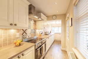 Beautiful well equipped kitchen with all mod cons and large range oven