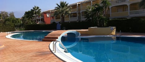 Swimming pool, children's pool life guard in season and sun bathing area