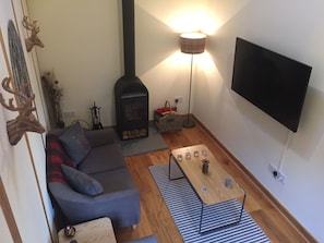 Living room with Scandinavian wood fire seats 4  