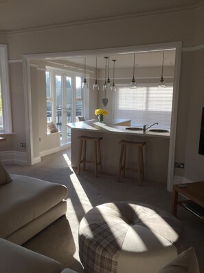 View of kitchen and second balcony from living area 