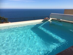 the heated pool has beautiful uninterrupted views of the sea
