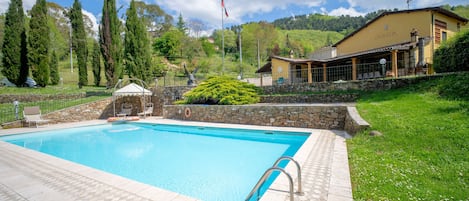 Private pool with large equipped lawn