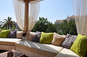 VIEW TOWARDS THE SEA AND NEIGHBOUR GARDEN WITH FRUIT TREES AND FLOWERS
