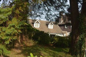 Windows of the living area and bedroom from the garden