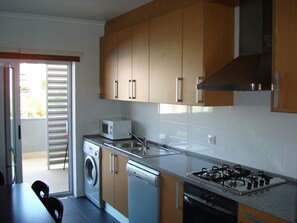 Spacious kitchen with washing machine, dishwasher and all mod-cons.