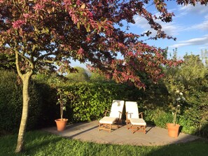 Loungers in the patio to catch evening sun