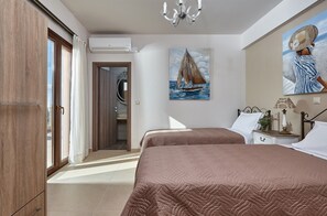 Orelia Cretan Deluxe Apartments - Das Schlafzimmer mit zwei Einzelbetten