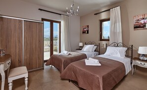 Orelia Cretan Deluxe Apartments - Das Schlafzimmer mit zwei Einzelbetten