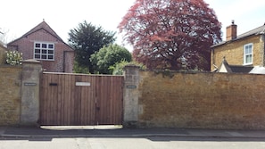 View from the street with the gates shut to keep chickens and children safe