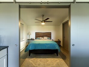 Bedroom with barn doors for option of open feeling or closing off for privacy.