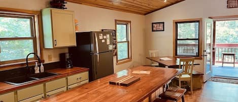 Kitchen and dining area view from entry.