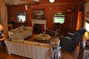 Living/TV area.  2 sleepable sofas, recliner and television.