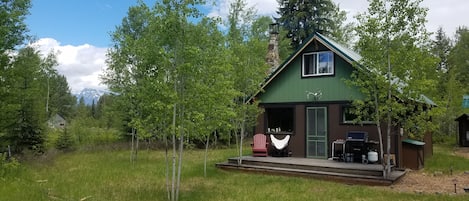 Lovely front porch for grilling and relaxing in the western exposure...