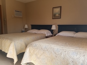 Full size extra long beds.  Multi-port charging stations on night stands.