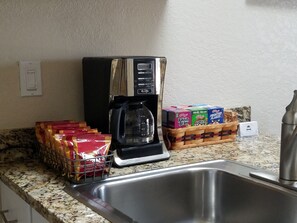Coffee, filters, cream and sugar are provided.  There is also cereal and oatmeal