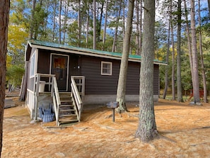 Cabin is nestled among the pines—parking available for two vehicles